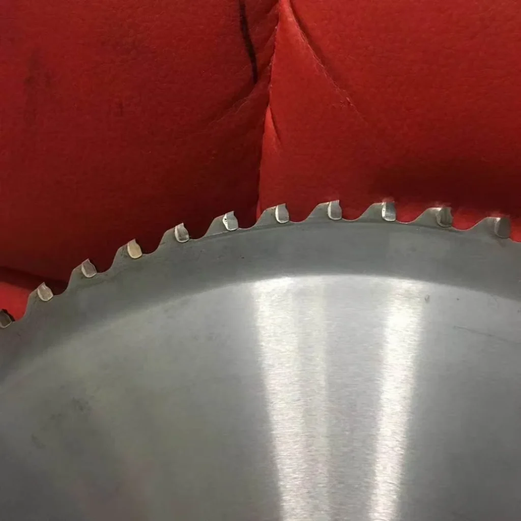 Close-up of the toothed edge of an HSS circular saw blade